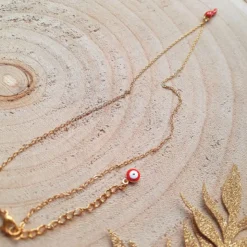 Collier doré avec charms piment rouge