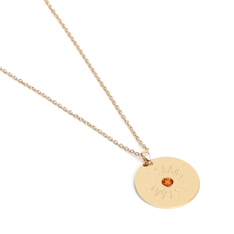 Collier médaille Soleil artisanal en acier inoxydable doré et perle de verre